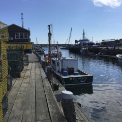 Fishing boats and lobster traps on a Wharf